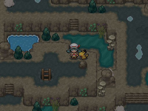 A trainer and following Pokemon explore rock ledges, narrow water channels and ladders inside a cavern.