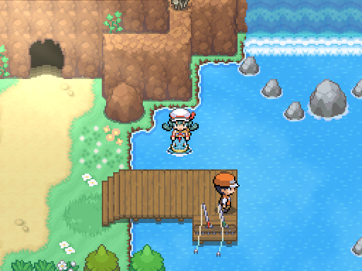 A trainer rides on the water beside a pier, cave entrance and small waterfall.