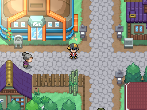A trainer stands at a paved junction beside an orange-roofed building and purple rooftops.