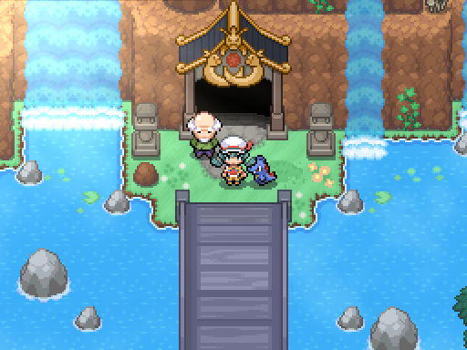A trainer and following Pokemon stand before an ornate entrance between two waterfalls.